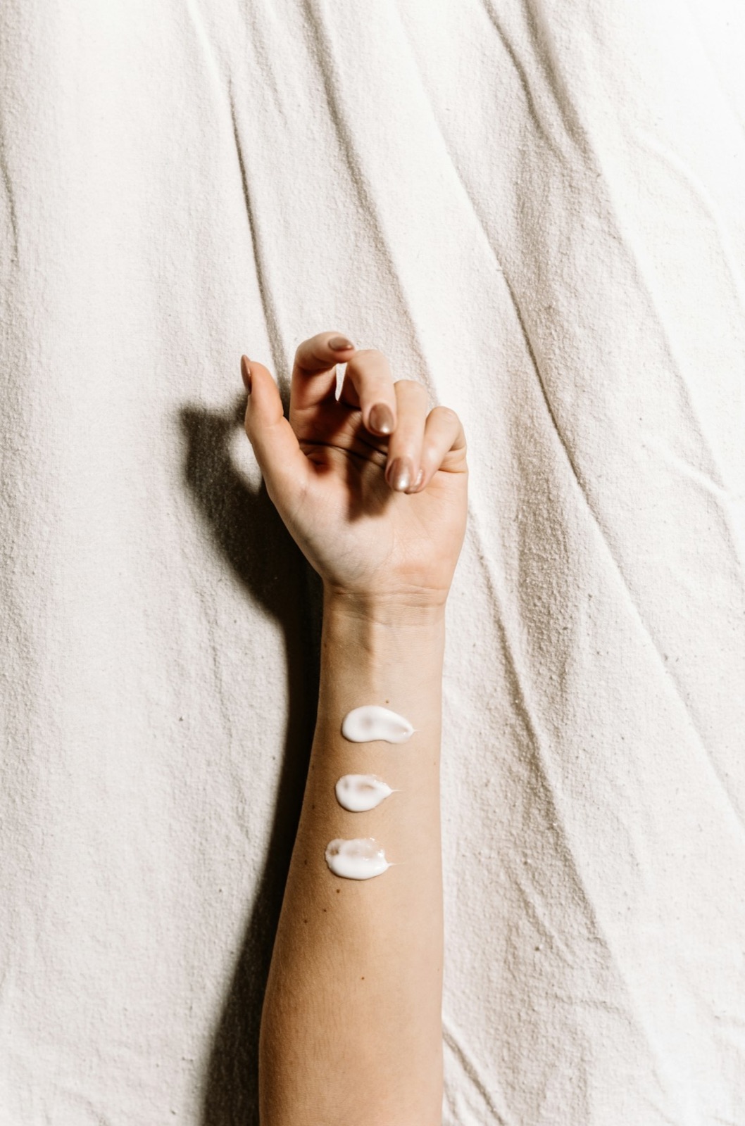 Skincare products arranged on marble